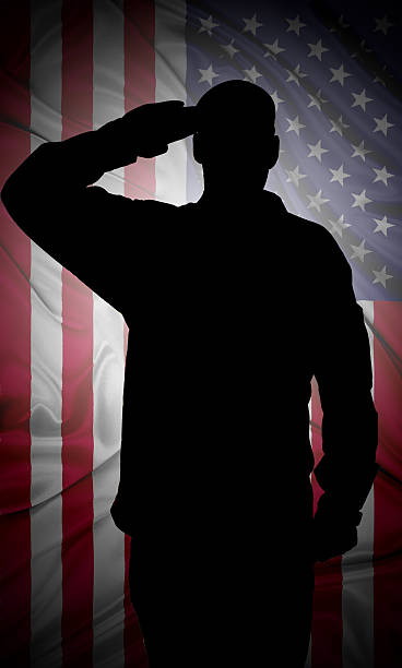 Saluting to USA flag Silhouette of American (USA) soldier saluting to USA flag air force salute stock pictures, royalty-free photos & images