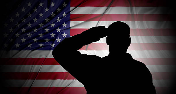 istock Saluting to USA flag 528578810