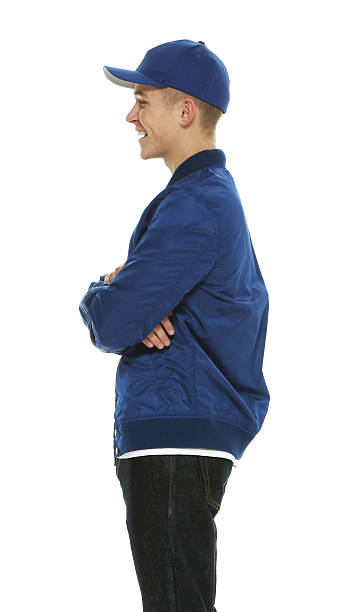 istock Smiling male standing with arm crossed 528579480