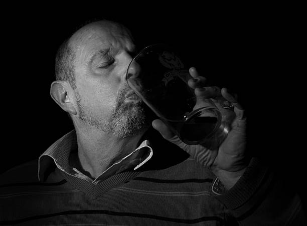 istock mature male having a beer with black back round 528579780