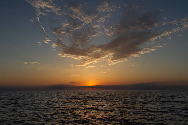 istock Sunset at sea. Clouds in the sky. 528581668