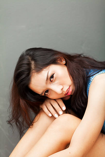 istock Thai transgender with head on knees 528581708
