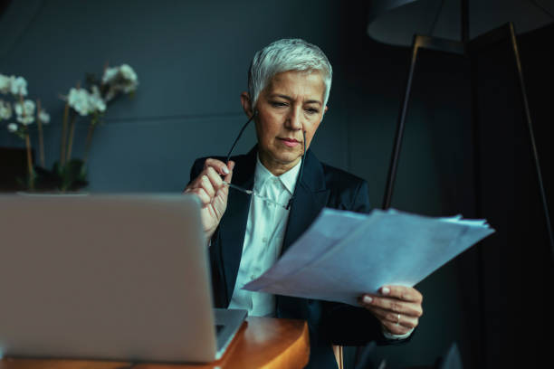 istock Mature businesswoman Examining Documents. 528582948