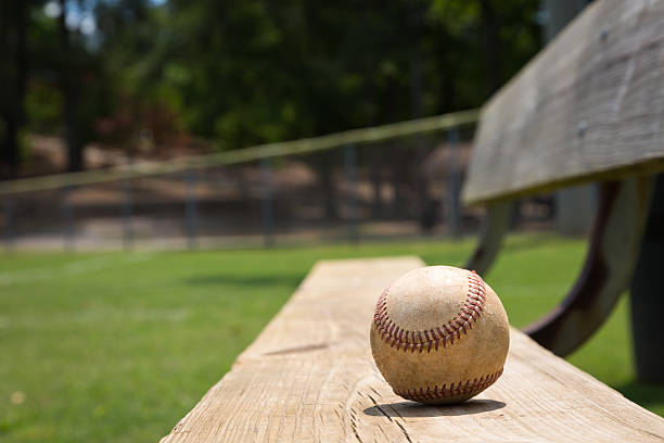 Baseball bench Baseball on a bench in a little league field outfield stock pictures, royalty-free photos & images