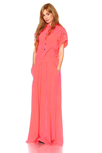 istock Girl in pink dress with tablet computer 528583827