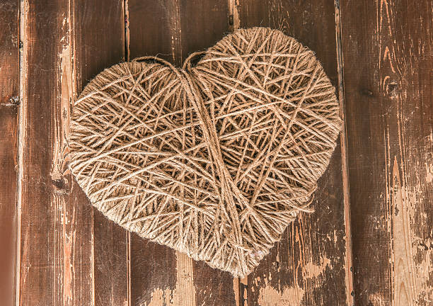 istock heart symbol wound with rope 528584267