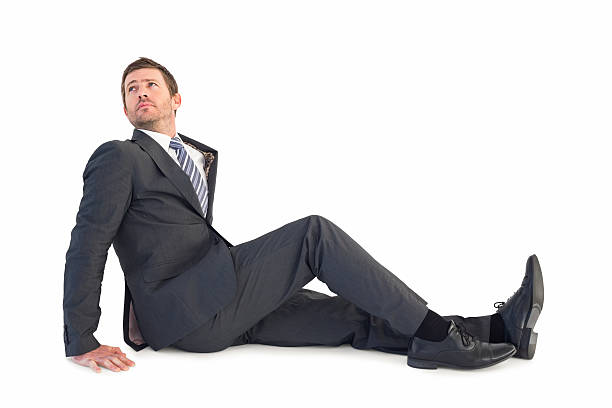 istock Businessman sitting and looking up 528584443