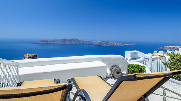 istock View on Santorini's volcano and caldera from hotel balcony 528585083