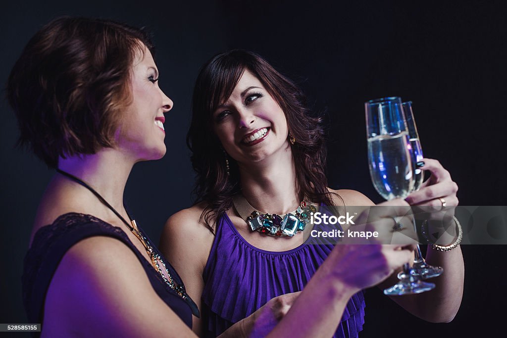 Friends celebrating with champagne Friends celebrating with champagne, new years eve. Elegance Stock Photo