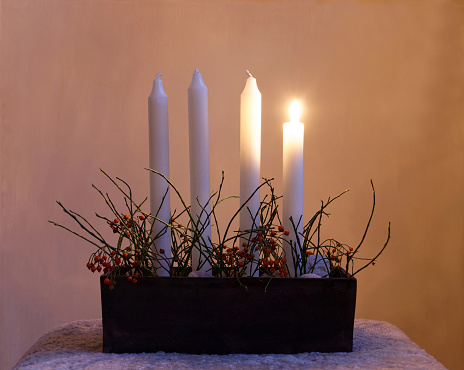 White antique candle lantern centerpiece at wedding reception dinner setting