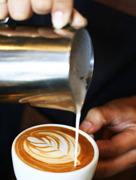 istock hand of barista making latte or cappuccino coffee 528586733