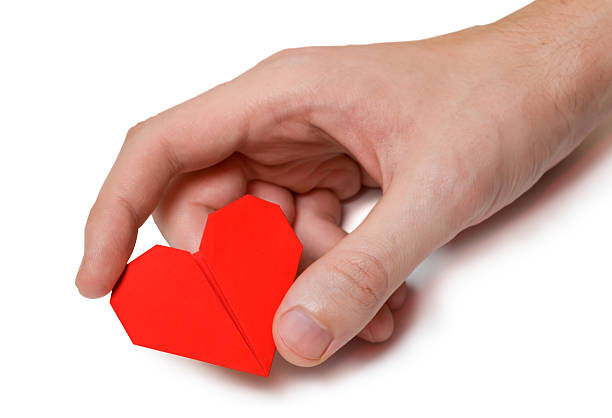 istock Paper heart in hand 528587173