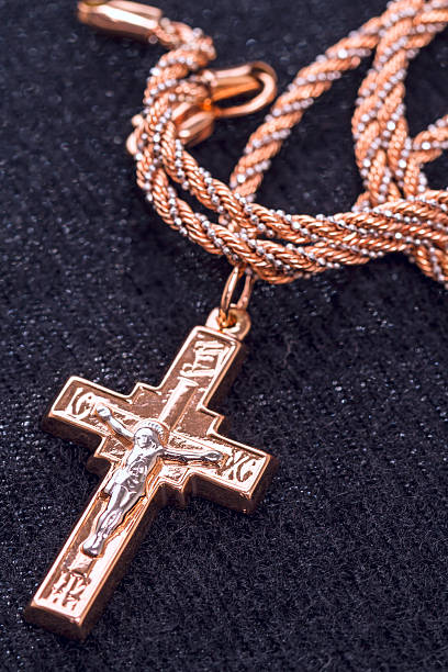 istock Golden cross  on a black cloth 528587815
