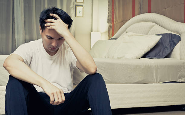 istock Asian man worry and sleepless near the bed 528588515