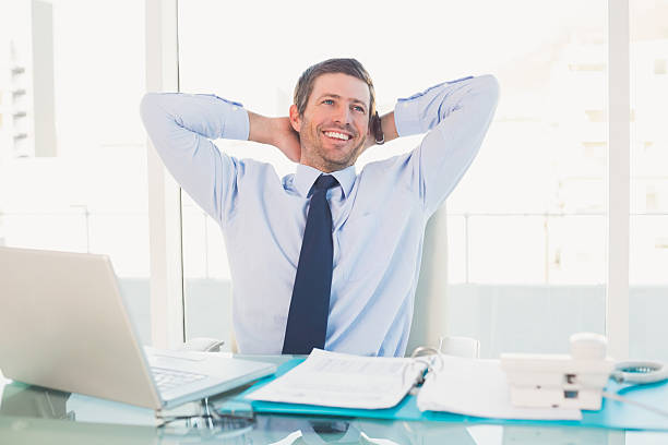 istock Relaxing businessman at his desk 528589039