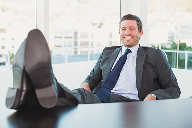 istock Relaxed businessman with his feet up 528589311