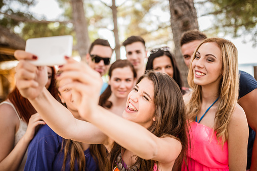 Group of college student laughing and doing a selfie