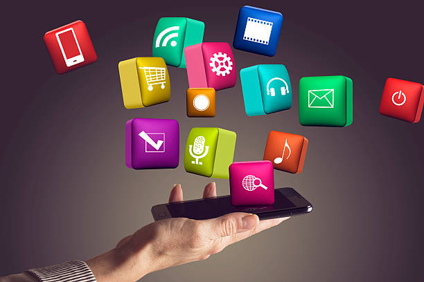 istock Hand holding smartphone with media icons and symbol 528606902