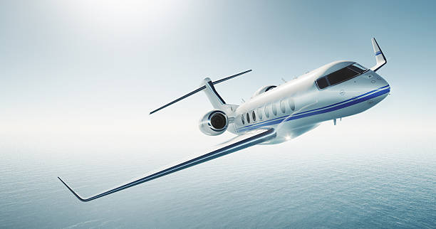 istock Photo of white luxury generic design private jet flying over 528606946