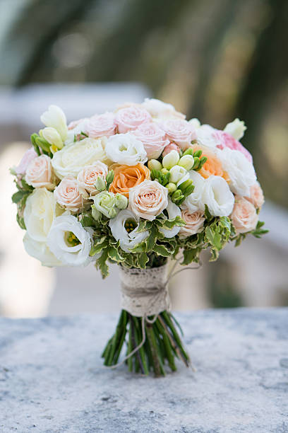 istock bridal bouquet of roses, freesia, eustoma 528606994