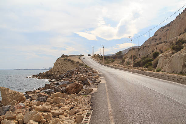 istock Destroy the road along the coast 528609044
