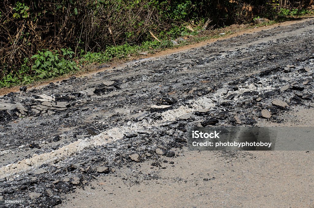 Road damage, with holes Asphalt Stock Photo