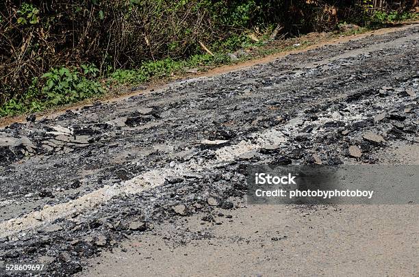 Road Damage With Holes Stock Photo - Download Image Now - Asphalt, Cement, Concrete