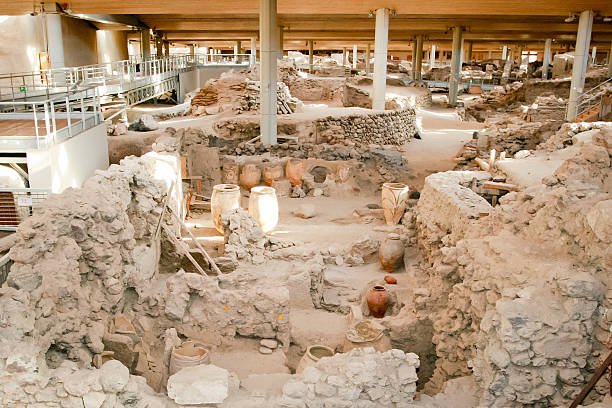 Akrotiri Archaeological Site on the Greek island of Santorini (Thera). Santorini, Greece - June 26, 2015: Akrotiri is an archaeological site from the Minoan Bronze Age on the Greek island of Santorini (Thera). Photo of recovered aincient buildings and decorated pottery. minoan photos stock pictures, royalty-free photos & images