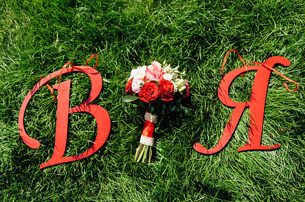 istock Beautiful bridal bouquet on a green grass 528610836