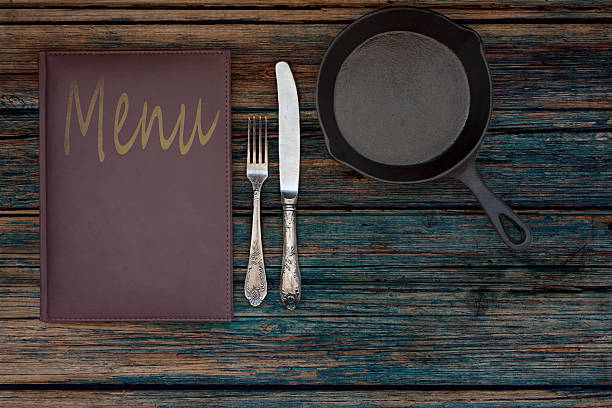 istock Vintage restaurant menu on a rustic wood background 528610948