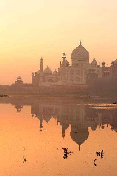 istock Taj Mahal view with reflection from Yamuna river bank. 528611424