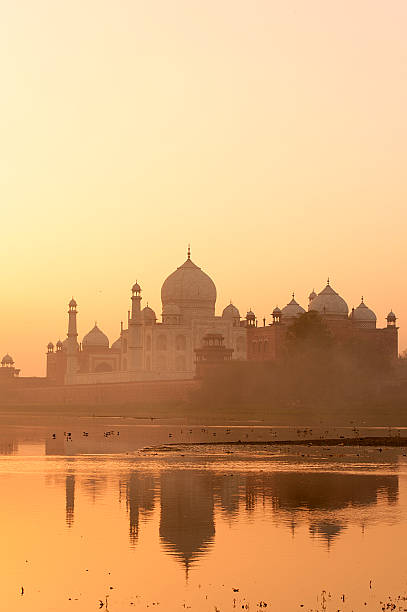 istock Taj Mahal view with reflection from Yamuna river bank. 528611508