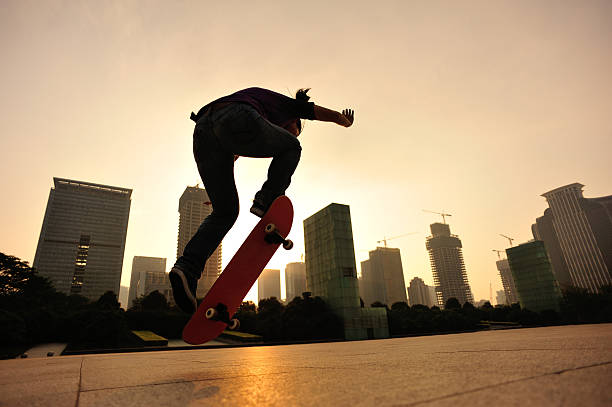istock skateboarding woman jumping at  sunrise 528612023