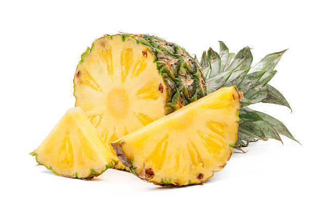 istock Half of pineapple and his slices isolated 528612689