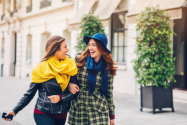 istock Two girlfriends walking on the streets of Paris 528613032