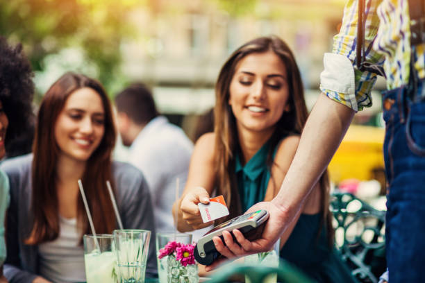 istock Woman making payment with credit card 528613280