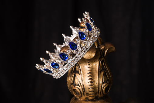 Royal crown with sapphires, luxury retro style. Indoor