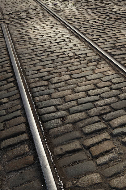 istock Old railway tracks and granite cobblestones on Brooklyn street 528616290