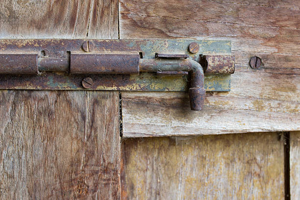 istock Old bolt on the old wooden door 528617490