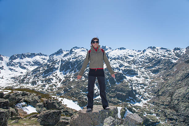 istock hiker woman posing on peak mountains 528618170
