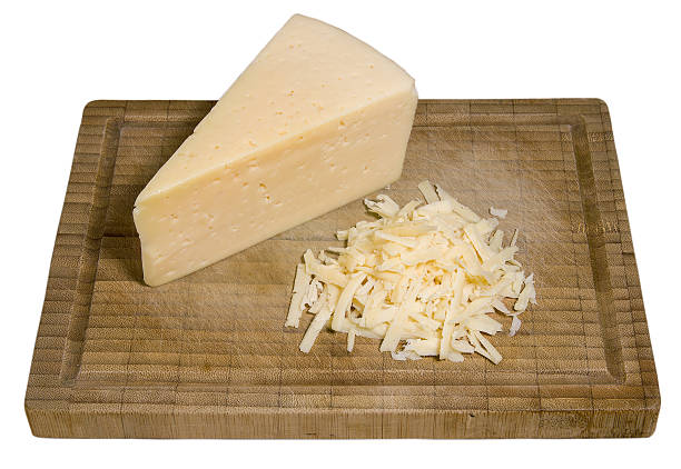 istock Shredded cheese and a piece of cheese 528620648