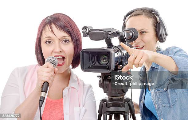Young Woman Journalist With A Microphone And Camerawoman Stock Photo - Download Image Now