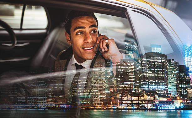 Businessman on a yellow cab in New York City Businessman on a yellow cab in New York City passenger photos stock pictures, royalty-free photos & images