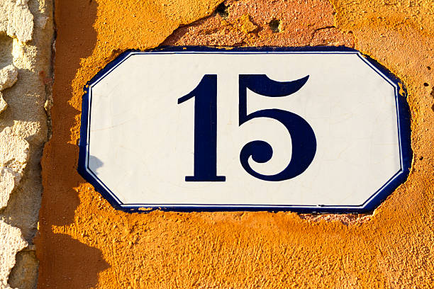 istock Number 15 Ceramic Address Plaque in Vibrant Old Orange Wall 528621114