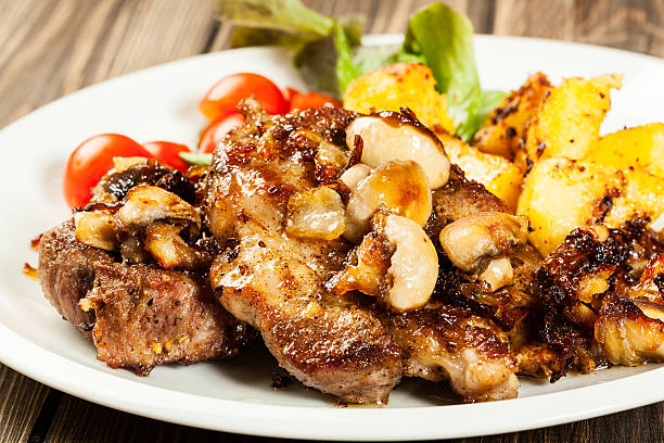 istock Fried pork chop with mushrooms 528621572