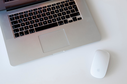 İstanbul, Turkey - May 6, 2016: 15-inch Apple MacBook Pro With Retina Display and Apple magic mouse 2. Isolated on white. 