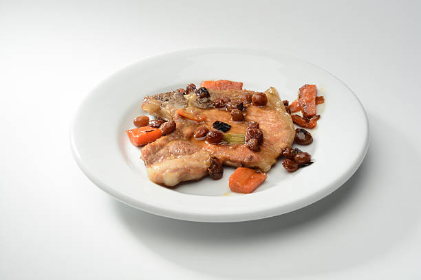 istock Pork steak and vegetables cooked with raisins 528623926