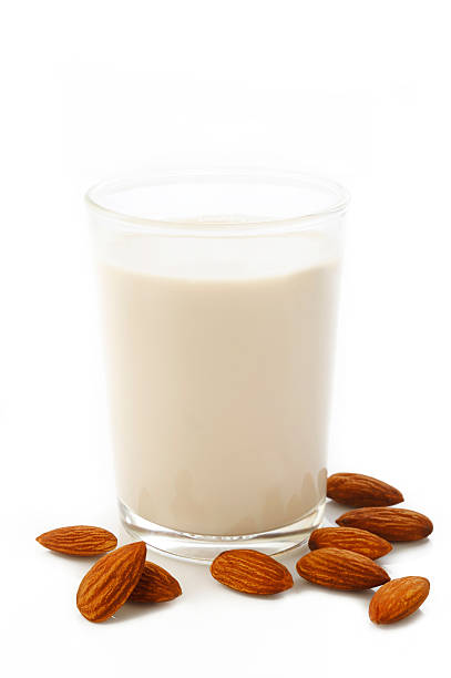 istock almond milk in glass with almonds 528623972