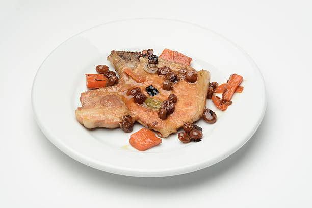 istock Pork steak and vegetables cooked with raisins 528624192