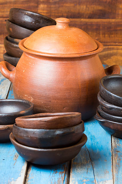 istock Clay dishes on wooden blue background 528624318